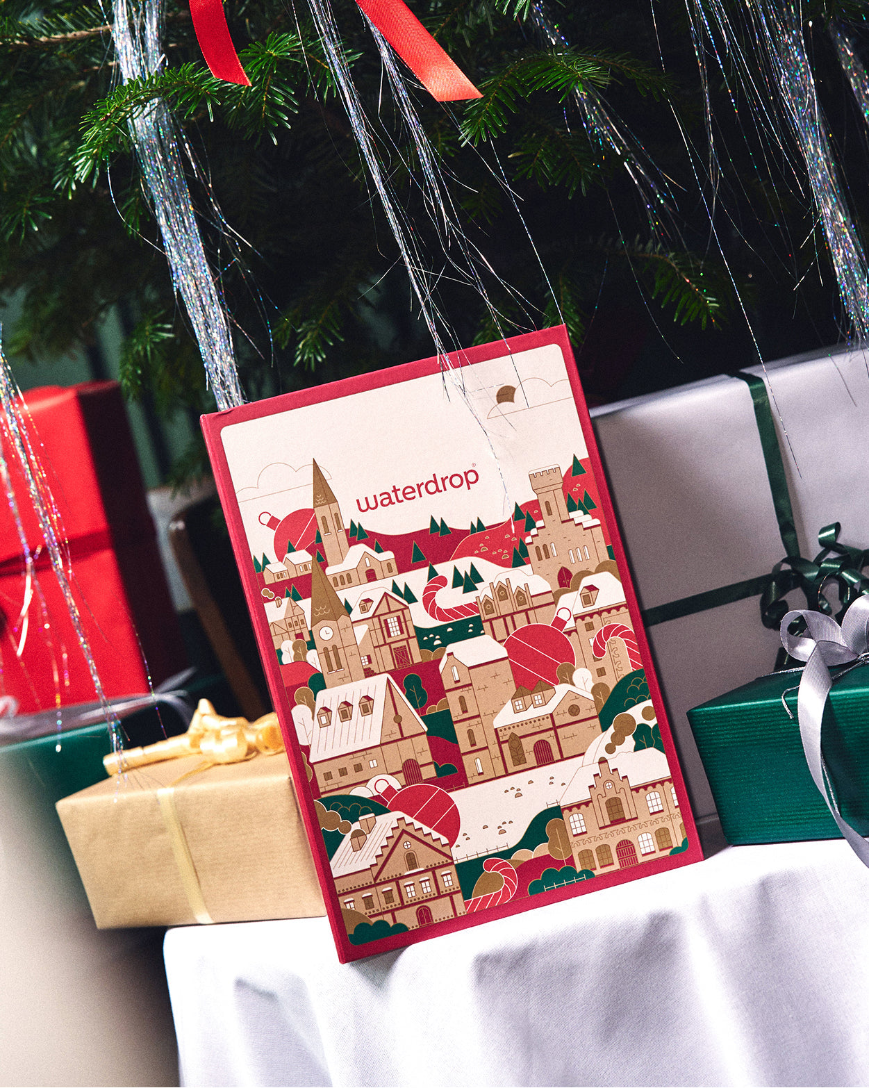 Apple Glass Gift Set under festive Christmas tree.