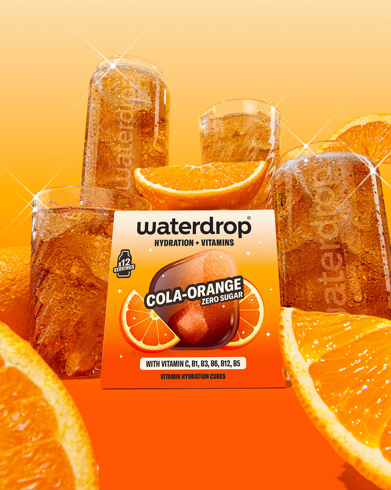 COLA ORANGE 3+1 vitamin hydration cubes with iced cola-orange drink.