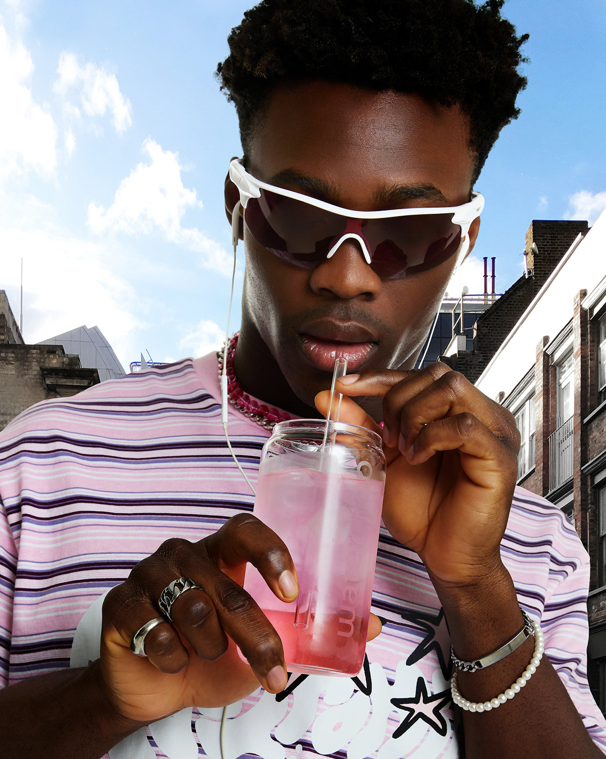 Person enjoying Best of Soft Drinks Set outdoors.