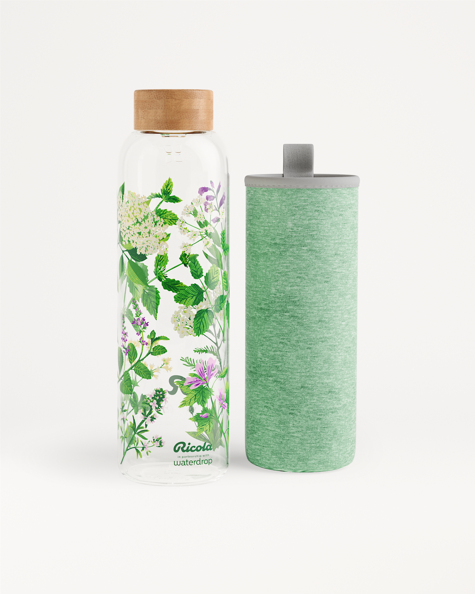 Ricola Edition Glass bottle with floral motif and sleeve.