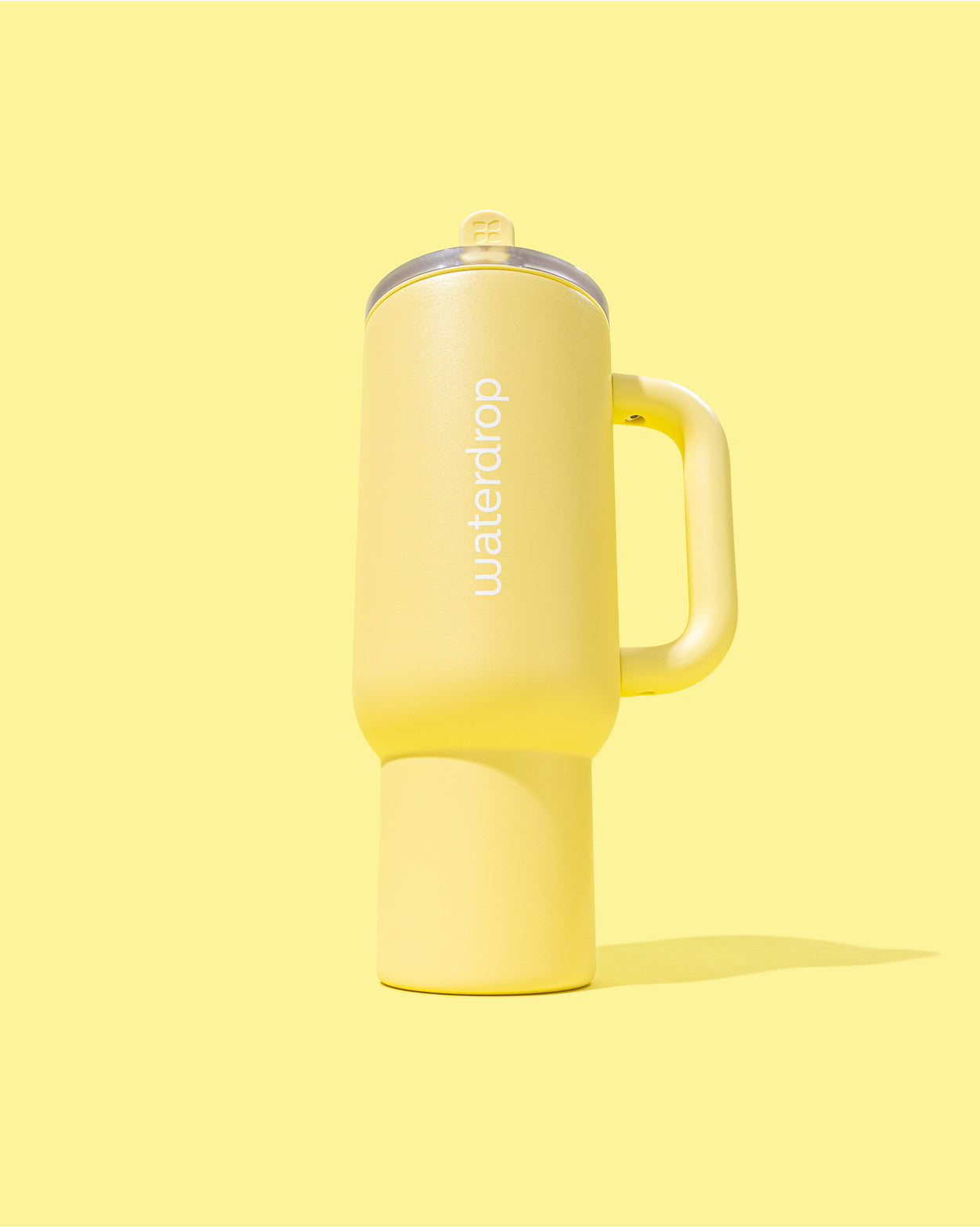Butter Yellow Explorer Thermo Tumbler with handle and flip-open straw.