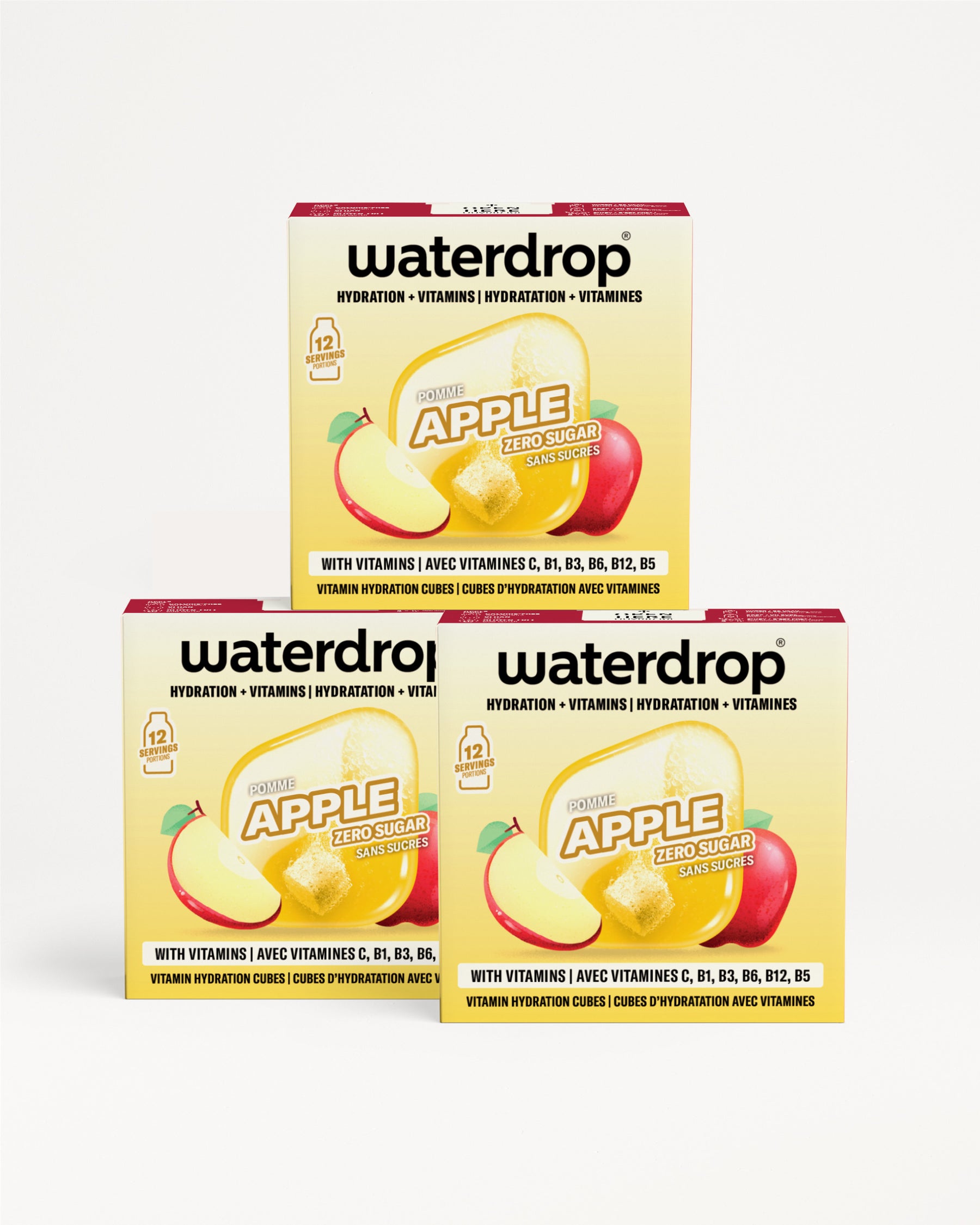Tri kutije Waterdrop jabuka hidratacijske vitaminske kapi smještene u piramidu.