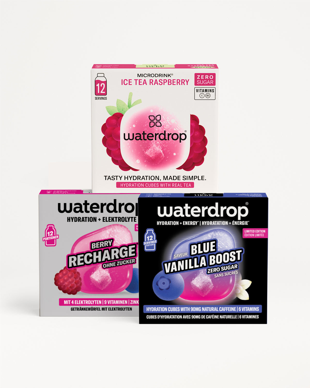 Tri kutije Waterdrop za hidrataciju složene u piramidu, s ružičastom, ljubičastom i plavom grafikom pakiranja.